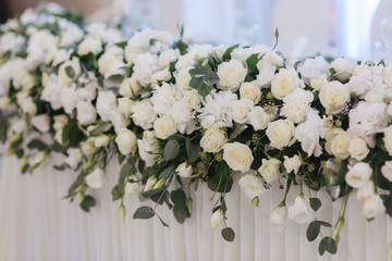 Floral decoration on the wedding table in the restaurant