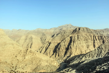 Fototapeta na wymiar Geological landscape of Jabal Jais characterised by dry and rocky mountains, Mud Mountains in Ras Al Khaimah, United Arab Emirates
