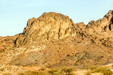 Fototapeta na wymiar Geological landscape of Saudi Arabia Mountains Characterised by Dry and Rocky Mountains of Wadi Gin, Saudi Arabia