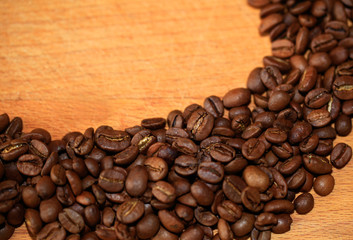Fried coffee beans close-up - excellent morning breakfast. Black Espresso.