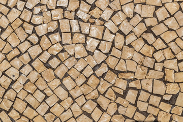 Street tile in Portugal. Light stone as a paving material.