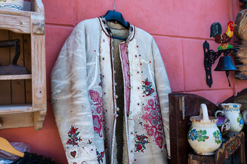 Hand made traditional colorful decorated saxon coat on the gift shop.