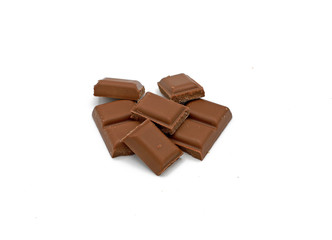 Milk chocolate pieces - isolated on white