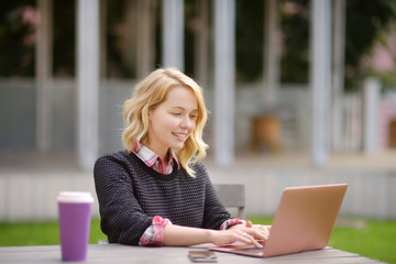 Young woman studying/working and enjoying beautiful day