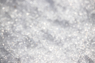 Obraz premium White silvery texture of defocused snow. Bright spotted bokeh.