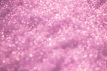 Purple violet defocused snow texture. Bright spotted bokeh.