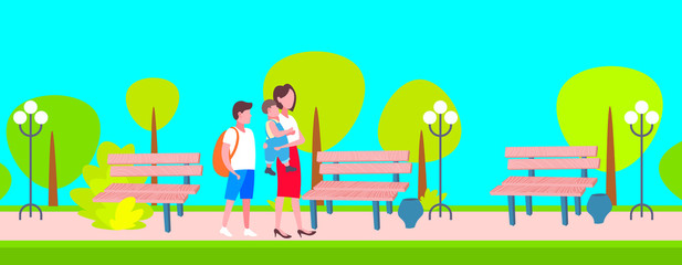 mother with schoolboy and baby boy walking in city public park happy family woman with two children enjoying walk outdoor landscape background full length horizontal