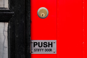 Push stiffy door to open sign red and black