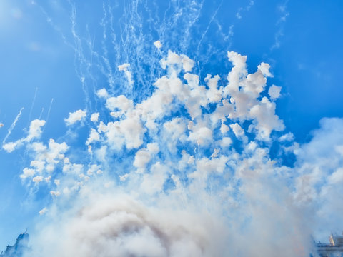 sky of valencia during a mascleta in the festival of fallas. Thousands of pyrotechnic elements called masclets, explode every day during the festivities filling the city with smoke and color. 