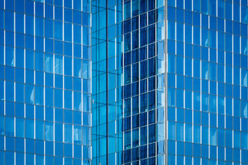 Glass of modern tower for business background, blue tone