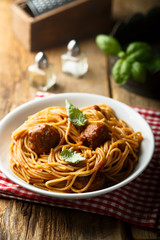 Pasta with meatballs and green basil