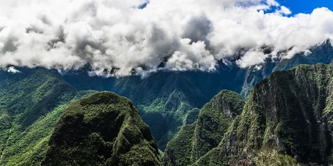 Foto op Canvas Clouds above the green peaks of the Andes © andrey_iv