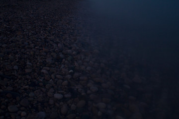 Evening sea with pebbles