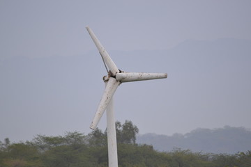 Wind turbine on blue sky