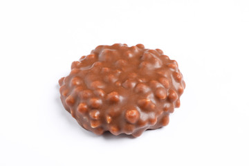 Chocolate cookie with caramel filling on white background