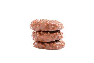 Stack of chocolate cookies with caramel filling isolated on white background