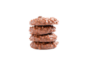 Stack of chocolate cookies with caramel filling isolated on white background