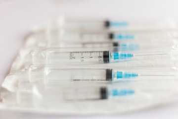 new disposable injection syringes in the package, close-up, selective focus