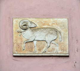 Symbol of sheep or rum on the old pink wall, Prague, Czech Republic