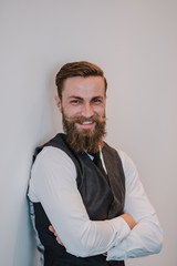 Fototapeta premium Handsome young bearded hipster businessman