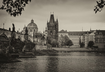 Dramatic cloudy autumn view of Charles Bridge, Vltava river, St. Vitus Cathedral, Prague Castle and...