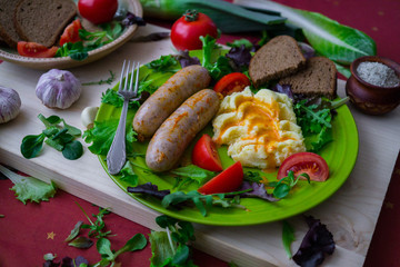 Home-made Pork Sausages along with mashed potatoes, poured with sweet paprika sauce.