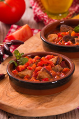 Marinated pork loin in tomato sauce.