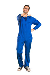 Fototapeta premium A full-length shot of a Painter man points finger at you with a confident expression on isolated white background