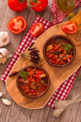 Marinated pork loin in tomato sauce.