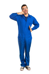 Fototapeta premium A full-length shot of a Painter man making phone gesture. Call me back sign on isolated white background