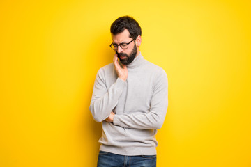 Man with beard and turtleneck with toothache