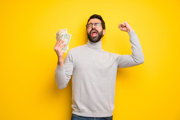 Man with beard and turtleneck taking a lot of money