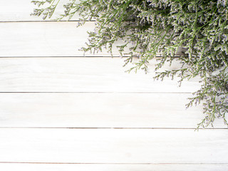 purple limonium flowers on white wooden background