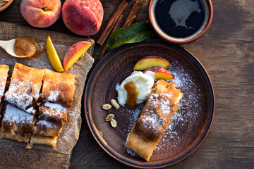 strudel with peaches, apples and peanuts