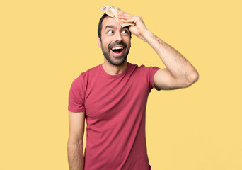 Man taking a lot of money has just realized something and has intending the solution on isolated yellow background