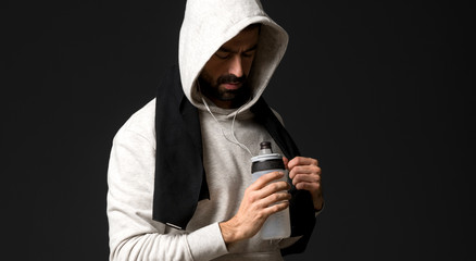 Sport man over dark background
