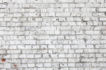 Old wall made of red brick, painted white in loft style for modern designer interior of room, bar or restaurant