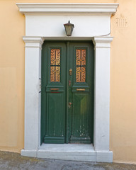 Fototapeta premium vintage house green door, Plaka old neighborhood, Athens Greece