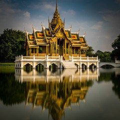 Fototapeta na wymiar Calm temple in Ayutthaya, Thailand with long exposure reflection in lake