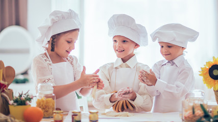 happy little children in the form of a chef to prepare delicious