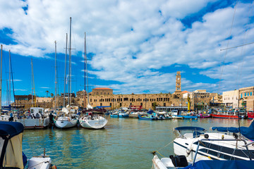 View on marina with yachts and ancient walls of harbor in old city Acre, Israel, Middle East