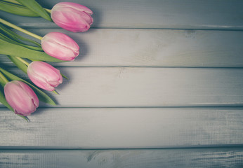 A bouquet of pink tulips with a frame for inscription.