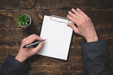 Signing of business contract or agreement mock up. To do list with copy space. Blank paper page in...