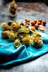 sweet, orange fruit and physalis flowers