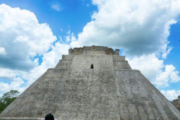 The Pyramid of the Magician, Uxmal, Mexico with a smaller mayan ruin in the foreground