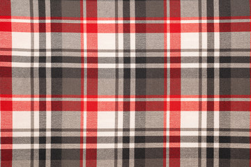 Tartan plaid natural cotton fabric. Seamless tiles texture for the background