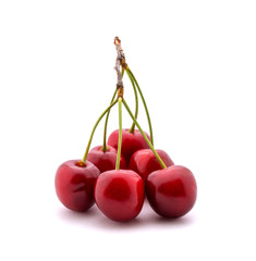 Photo of red cherries isolated on white background