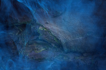 Obraz na płótnie Canvas Cracked pine bark close up covered with mystical blue mist