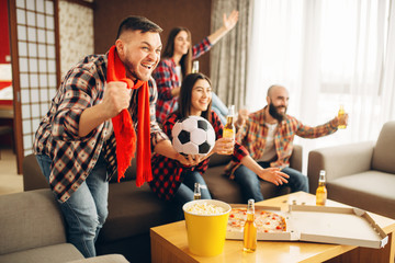 Friends cheer for favorite team, football fans