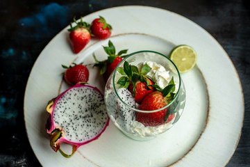 whipped cream with strawberries and dragon fruit